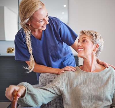 Supportive nursing care in Orlando with a caregiver assisting a senior woman, reflecting our commitment to senior independence