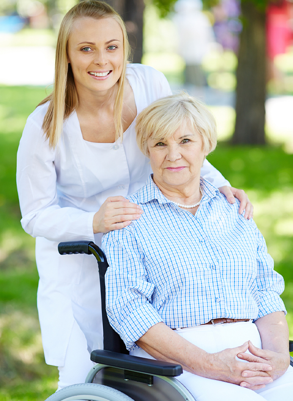 Caregiver with senior in a Palm Beach park, displaying the mobile assistance aspect of home care